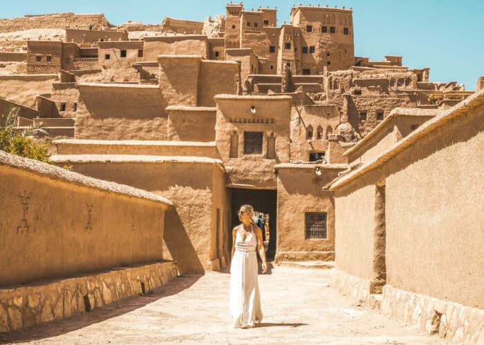 Woman walking through the ancient Ksar of Ait Benhaddou during the 6 day Morocco tour from Marrakech to Merzouga