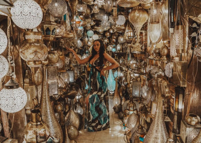 Woman in traditional lamp shop in Marrakech during the 6 day Morocco tour from Marrakech to Merzouga